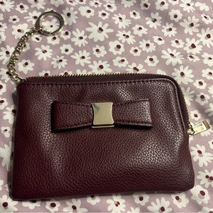 Purple zipper pouch with card slots with a bow